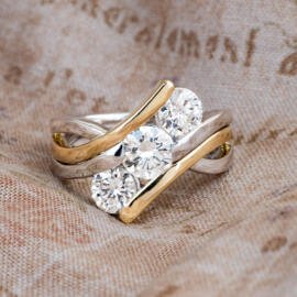 Custom three stone two tone engagement ring front view