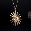 Large custom sun starburst pendant with lab diamonds in 18k yellow gold back view