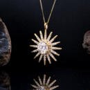 Large custom sun starburst pendant with lab diamonds in 18k yellow gold side view