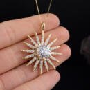 Large custom sun starburst pendant with lab diamonds in 18k yellow gold in hand