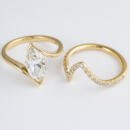 Custom marquise diamond wedding set in yellow gold top view with separate engagement ring and wedding band