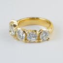 Custom yellow gold five stone diamond band top view