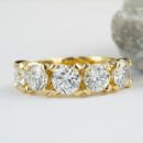 Custom yellow gold five stone diamond band front view
