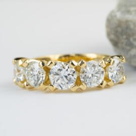 Custom yellow gold five stone diamond band front view