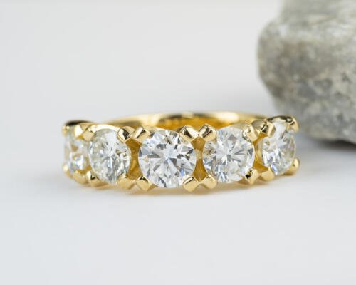 Custom yellow gold five stone diamond band front view