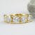 Custom yellow gold five stone diamond band front view