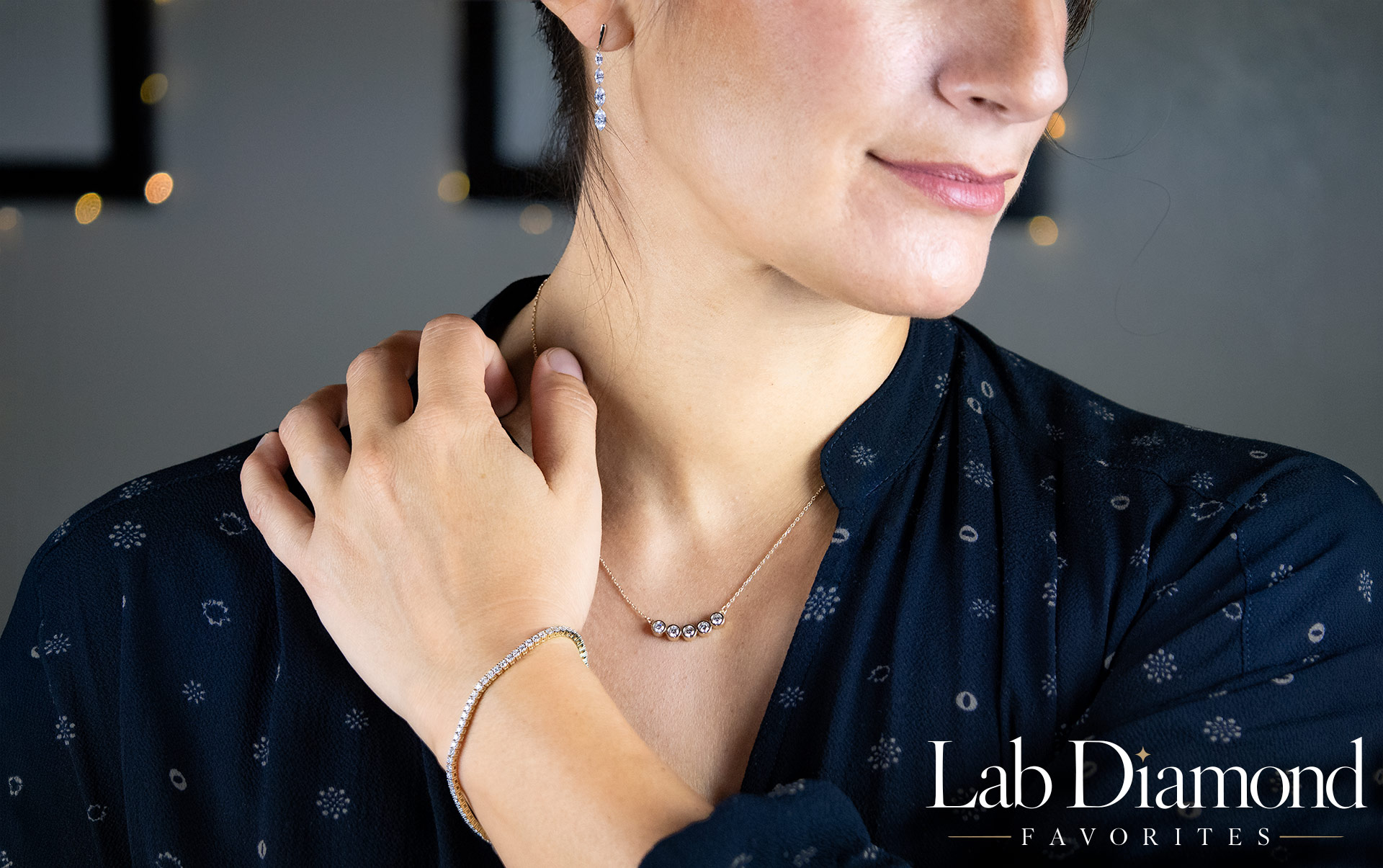 A beautiful model wearing three pieces for the Lab Diamond Favorites collection
