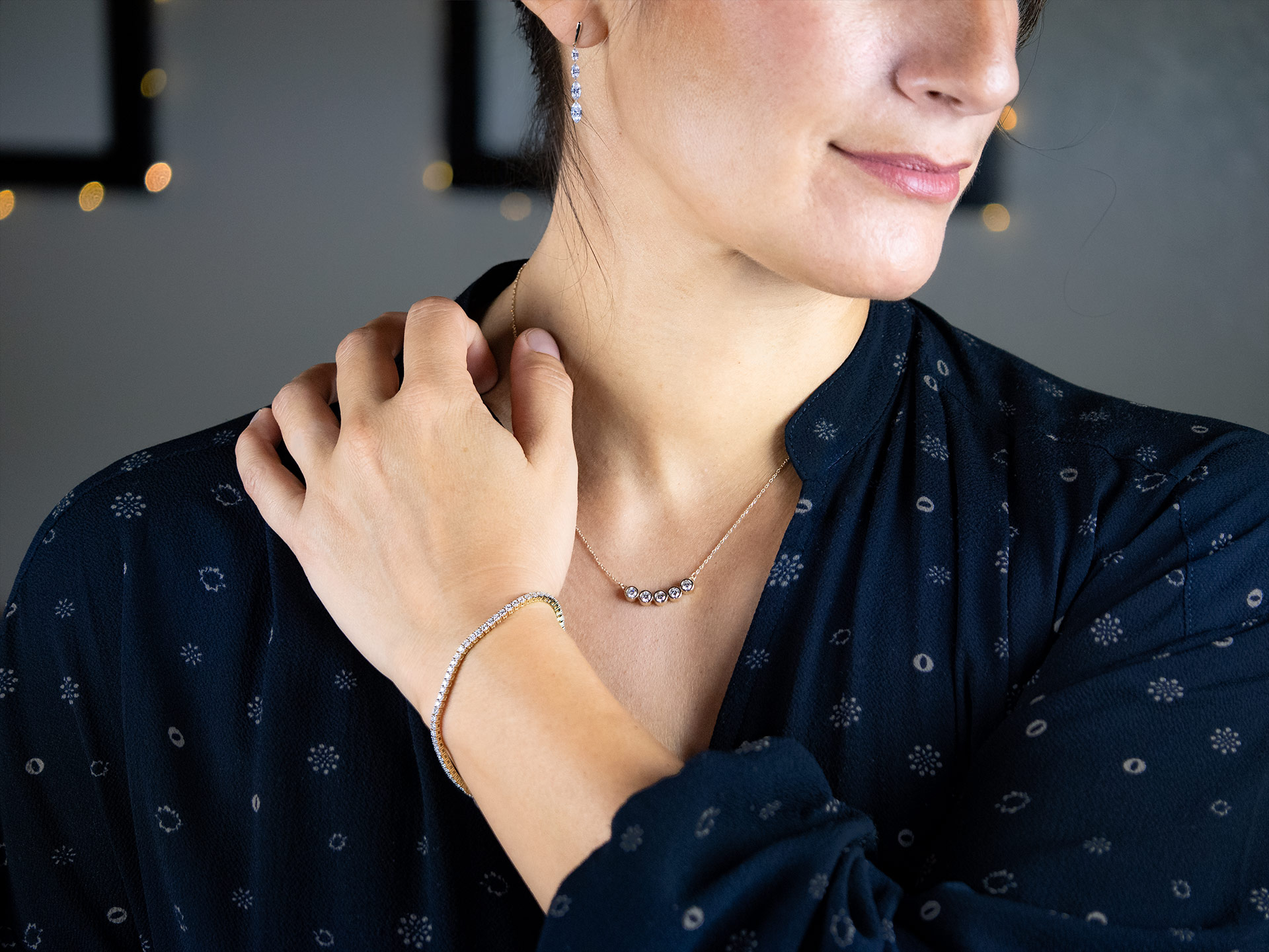 A beautiful model wearing three pieces for the Lab Diamond Favorites collection